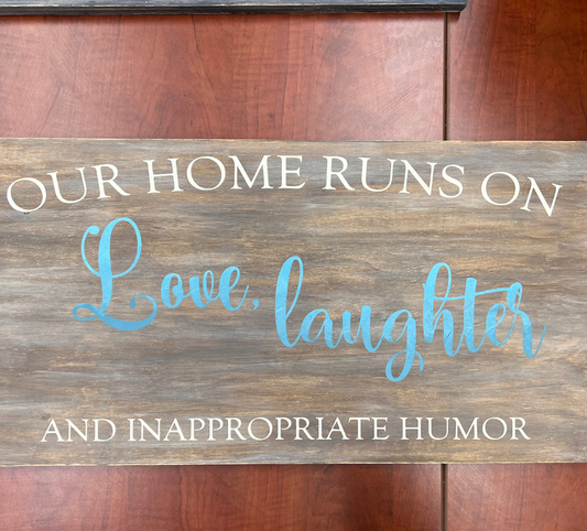 Our home runs on love, laughter and inappropriate humor sign