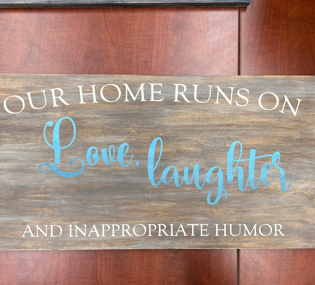 Our home runs on love, laughter and inappropriate humor sign