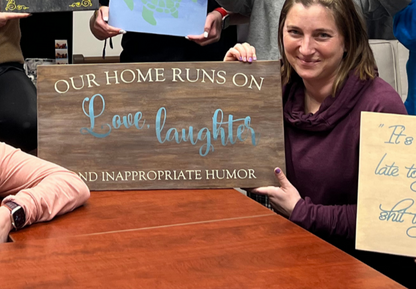 Our home runs on love, laughter and inappropriate humor sign